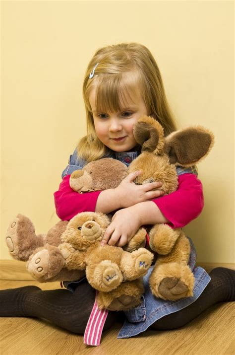 Little Girl Holding Toys Stock Image Image 38015581