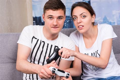 Premium Photo Portrait Of Young Male And Female Gamers Playing Video