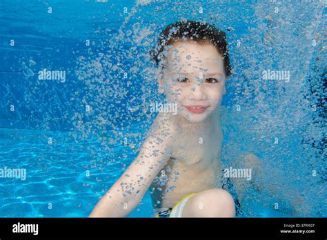 Young Boy Holds Her Breath While Floating Underwater Stock Photo Alamy