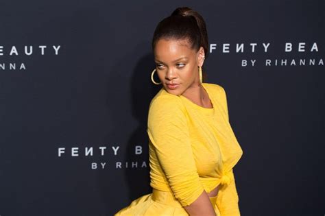 Rihanna Stuns In Yellow Dress As She Celebrates Fenty Beauty Launch At