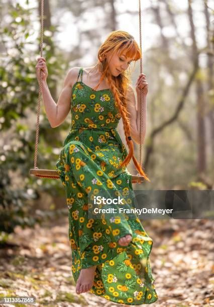 Bashful Beautiful Young Woman In The Public Parc Woods Swinging On A