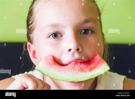 Cute Girl Eating Watermelon Stock Photo Alamy