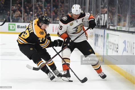 Charlie Mcavoy Of The Boston Bruins Fights For The Puck Against Ryan