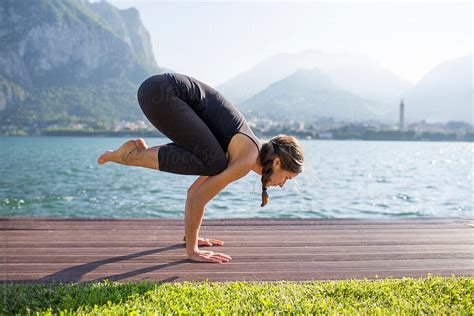 Woman Doing Yoga Pose Bakasana By Stocksy Contributor Michela Ravasio Stocksy