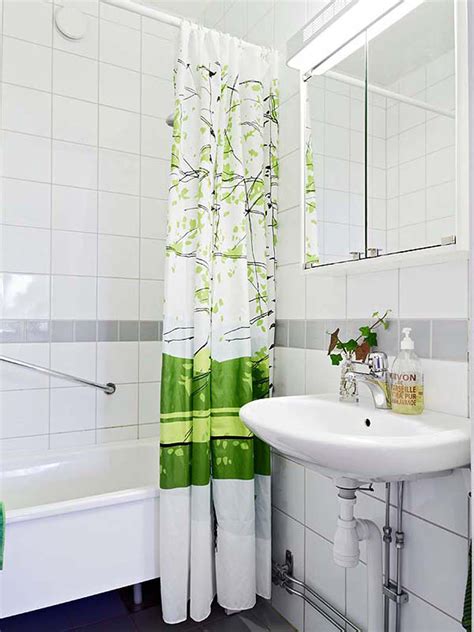 A skirt for the sink provides extra storage underneath, and the pages of an old book are taped to the wall for inexpensive and effective decoration. 30 Beautiful Small Bathroom Decorating Ideas