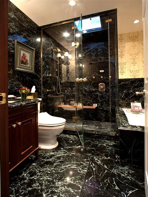 Elegant Marble Bathroom With Glass Enclosed Shower And Gold Fixtures