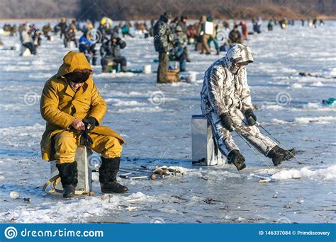 Men Sit On The Ice And Fish Winter Fishing In Russia Editorial Stock