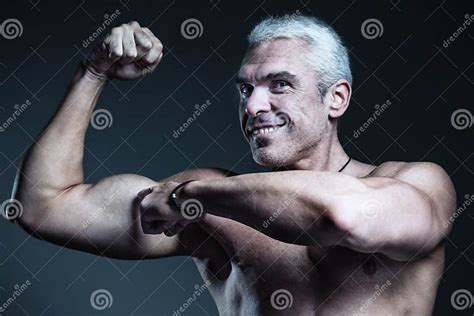 Strong Man Fitness Model Showing Flexing Bicep Muscle Healthy L Stock