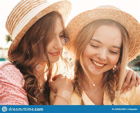 Portrait Of Young And Beautiful Women Posing Outdoors Stock Photo