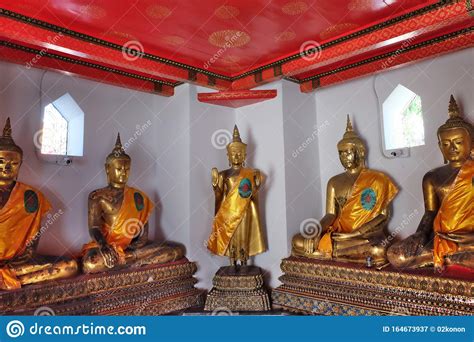 Gilded Statues Of Buddha Sitting In Lotus Position Statues From A