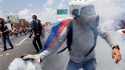 Venezuela Protesters And Police Clash At Opposition March Bbc News