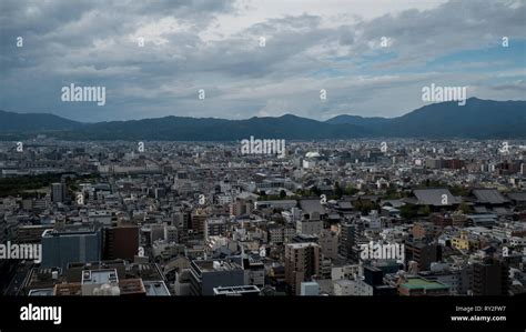 Aerial Shots Of The City Of Kyoto Skyscrapers And Buildings Expand Out