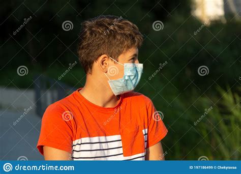 Close Up Cute Young Boy With Protective Mask On His Face Teenager In