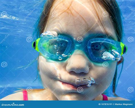 A Girl With Diving Goggles Dives In The Pool And Holds Her Breath Stock Image Image Of Glasses
