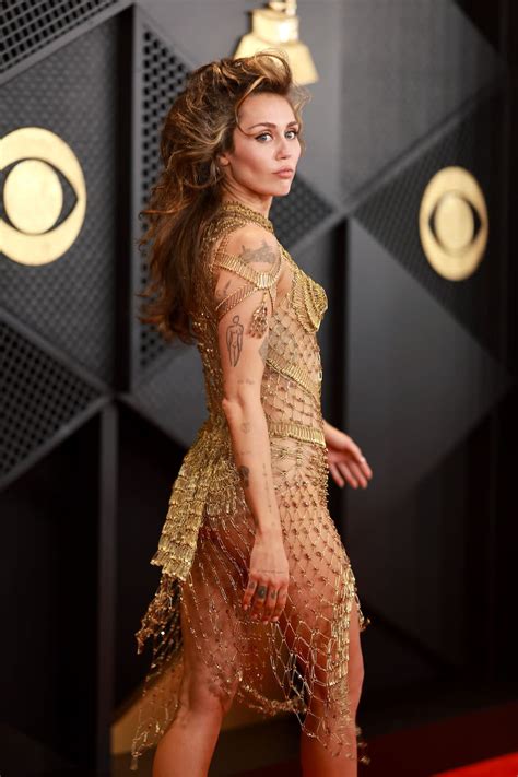 Miley Cyrus Wore A Completely Transparent Gold Netted Dress To The