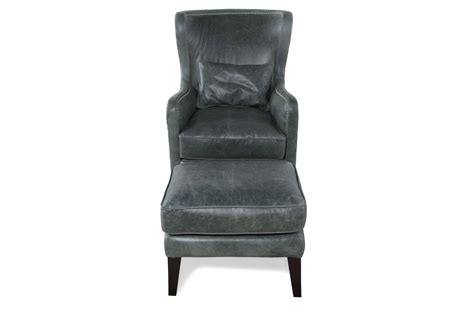 A clean design and teal faux leather upholstery completes this comfortable arm chair. Leather Chair and Ottoman in Teal | Mathis Brothers Furniture