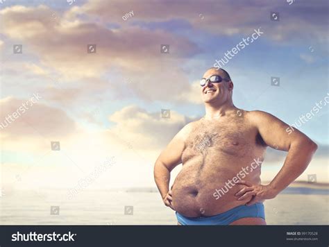 Smiling Overweight Man In Bathing Suit Stock Photo