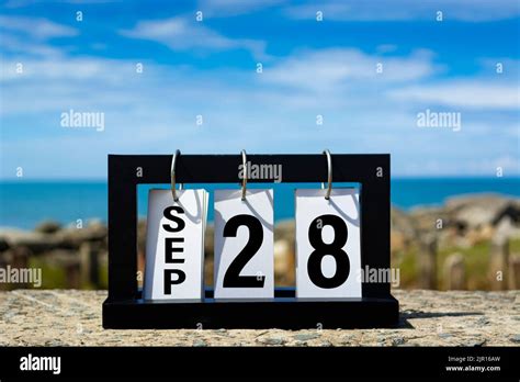 Sep 28 Calendar Date Text On Wooden Frame With Blurred Background Of