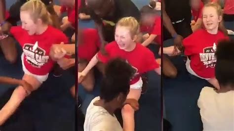 police investigating video of cheerleader crying while forced into splits what s trending now