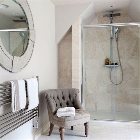 Book your free bathroom design appointment. Classic en-suite bathroom with travertine tiles ...