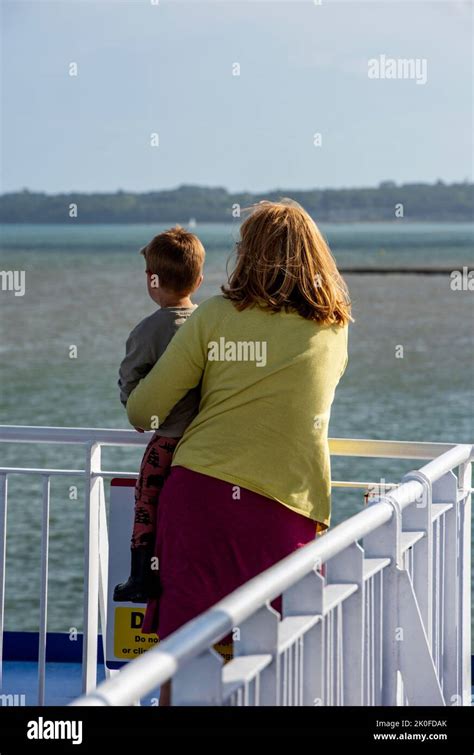 Grandmother And Grandson Looking At The Sea From A Pier Or Elevated