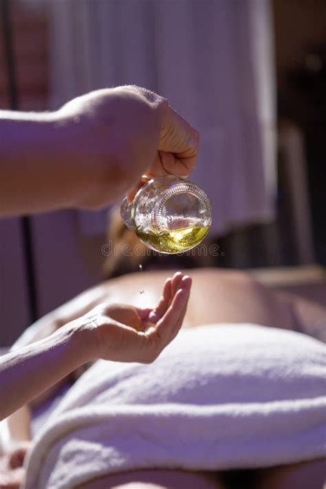 Massage Therapist Pouring Oil On Hands Stock Image Image Of Lying