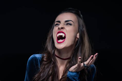 Grim Woman Showing Vampire Fangs Isolated On Free Stock Photo And Image