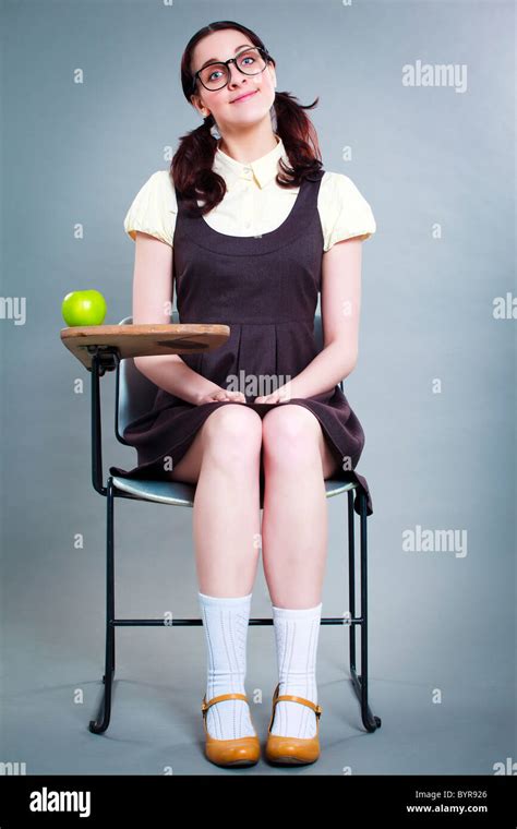 Good Geeky School Girl Quietly Sits At Desk Stock Photo Alamy