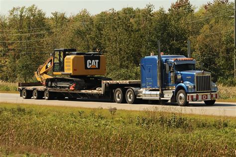 Kenworth W900 Heavy Haul Truck And Triaxle Dropdeck Trailer With A Cat
