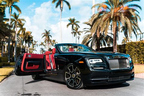 The marque's dedication to design and production standards make it the ultimate car manufacturer in terms of worldwide recognition and trust. 2018 Rolls Royce Dawn - Black & Red | MVP Miami Exotic Rentals