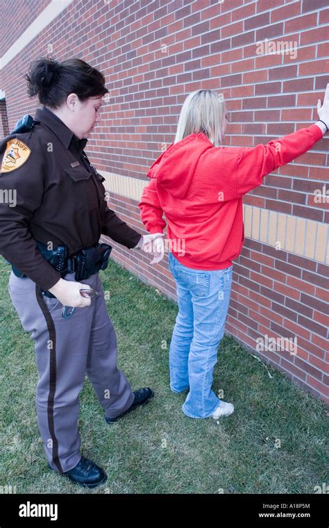 Young Female Being Arrested By Female Deputy Sheriff Saline County