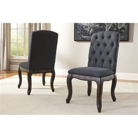 Find modern dining room chairs as dashing as the table itself. Ashley Trudell Upholstered Dining Chair in Dark Gray - D658-02