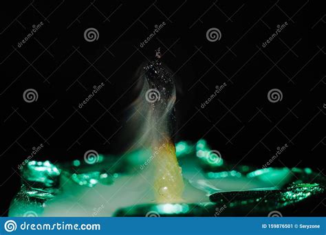 Macro Photography Of Fading Candle On Black Background Stock Image