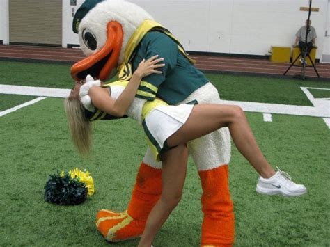 Oregon Ducks Cheerleader And Mascot Kissing