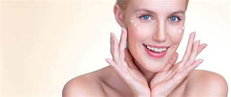 Premium Photo Personable Woman Applying Moisturizer Cream On Her Face