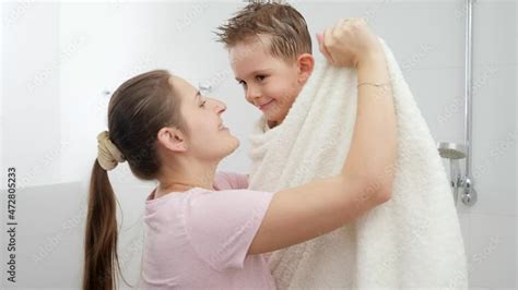 Caring Mother Drying Her Son With Towel And Hugging After Bathing