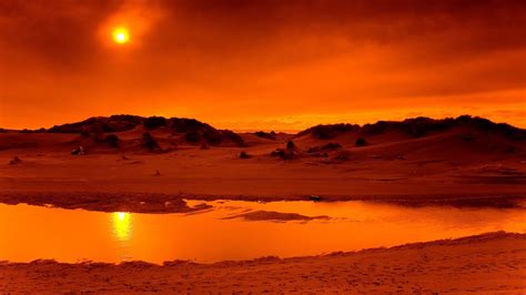 Sunset Over Sand Dunes Near Beach Sunset