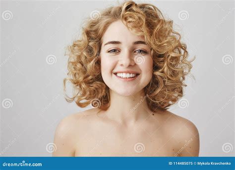 Skin Care And Beauty Concept Attractive Naked Curly Haired Woman With Charming Smile Gazing At