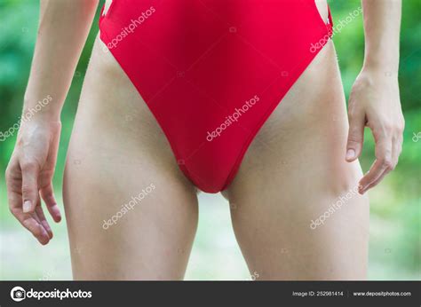 Close Up On A Slim Woman Body In A Red Swimsuite Stock Photo