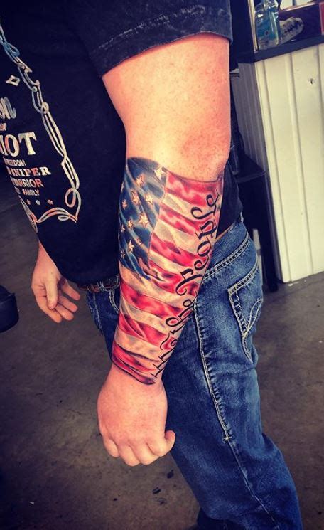 Flag tattoos can also be used as a reminder of past wars or battles. American Flag We The People 1776 Forearm Tattoo - Tattoo Ideas