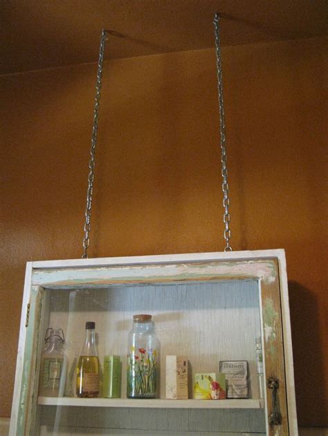 Medicine cabinets aren t just for meds anymore. Old medicine cabinet repurposed and hung from ceiling ...