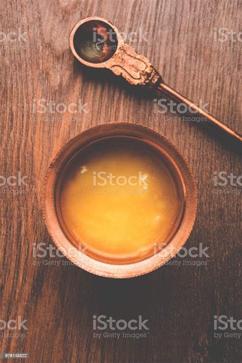Desi Pure Ghee Or Clarified Butter In Glass Or Copper Container With