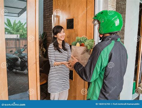 Smiling Woman Receiving Grocery Delivery At Home Stock Image Image Of