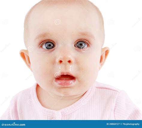 A Cute Sick Baby With A Runny Nose With The Tongue Out Stock Photo