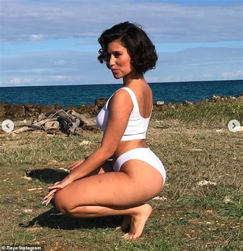 Raye Shows Off Her Incredible Figure In A White Bikini As She Poses On
