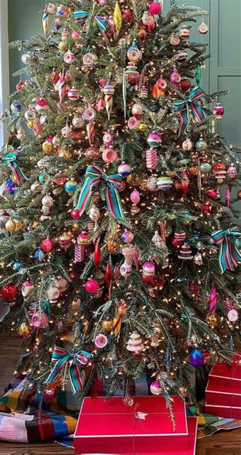 A Decorated Christmas Tree With Presents Under It