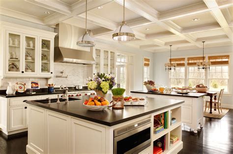 An off white paneled kitchen hood stands over a swing arm pot filler and a stainless steel stove. Black Granite Countertops Styles, Tips, VIDEO + INFOGRAPHIC