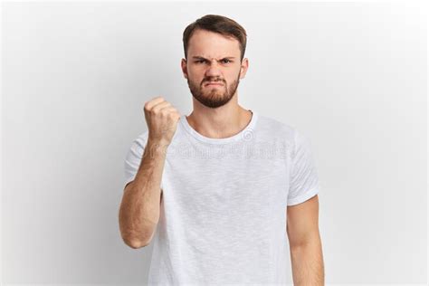 Angry Nervous Young Man Shows Clenched Fist Giving Warning Stock Image