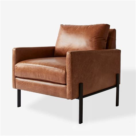 S olid malaysian oak in a cocoa stain. Gunnison Cognac Leather Chair by Unison - Dwell