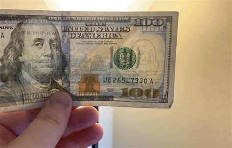 The Watermark On The 100 Bill Looks Like Curly From The Three Stooges